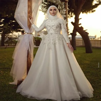 Роскошные арабские свадебные платья в Дубае Хрустальные бусины Аппликации Линия Свадебные платья Изготовленные на заказ с высоким воротником и длинными рукавами Robe de mariée